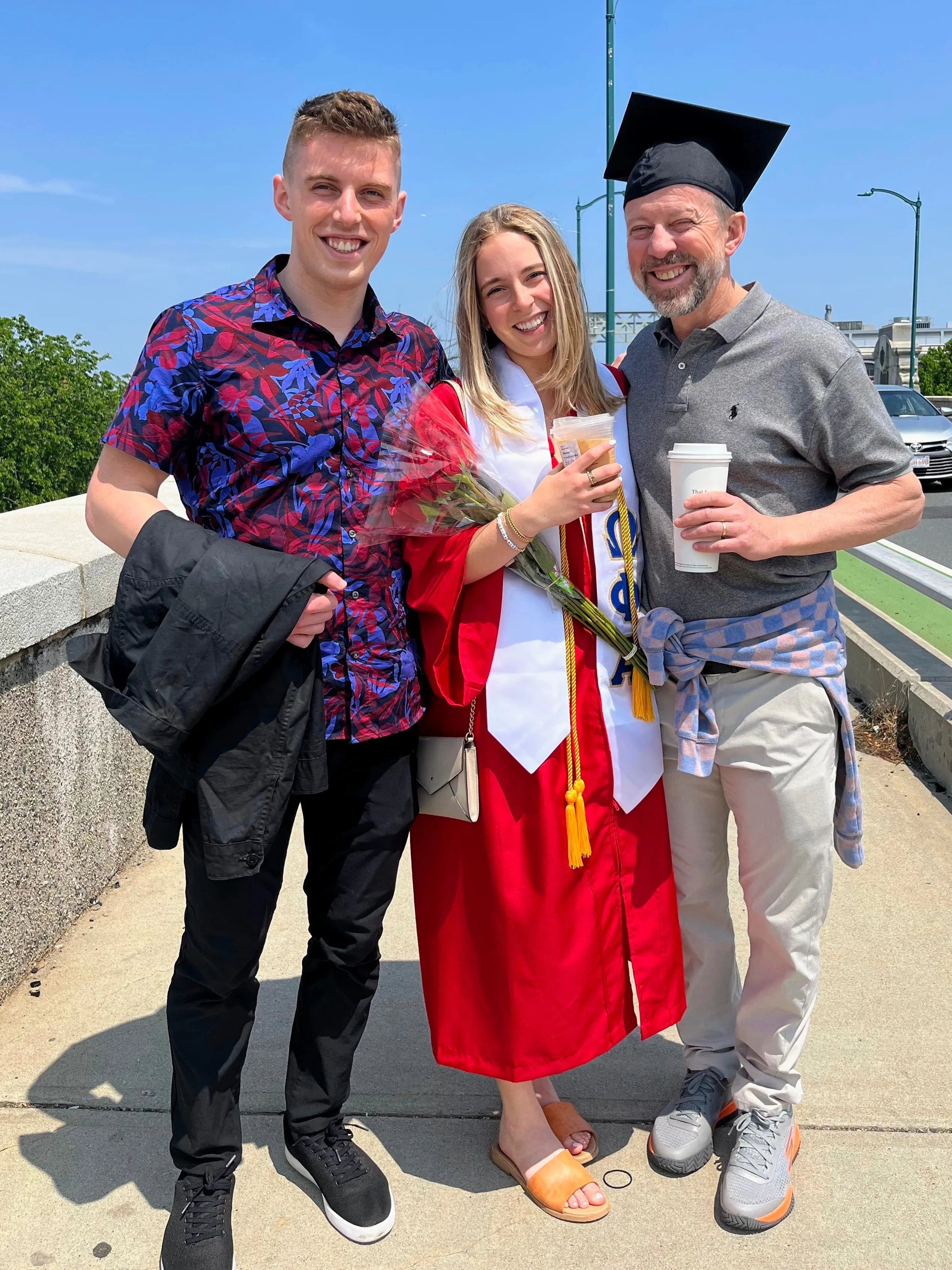 Kincaid smiling with his sister and dad