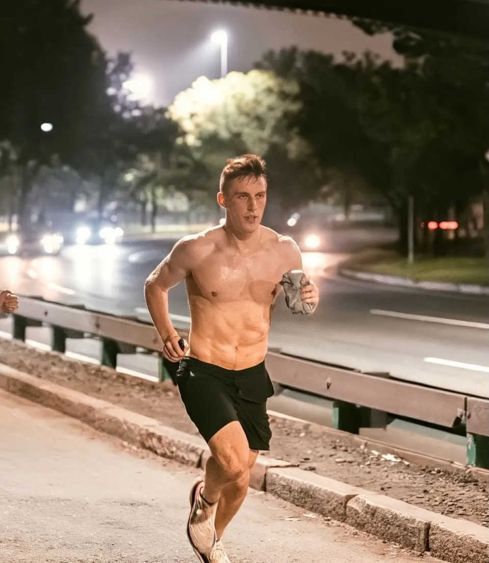 Man (shredded), running in the night (run club in Boston)